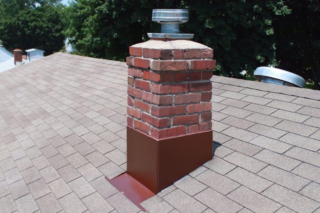 Professional Old Bridge Nj Roofing Repair a Brick Chimney with a Metal Cap on the Top Experienced Nj Roof Repair East Brunswick