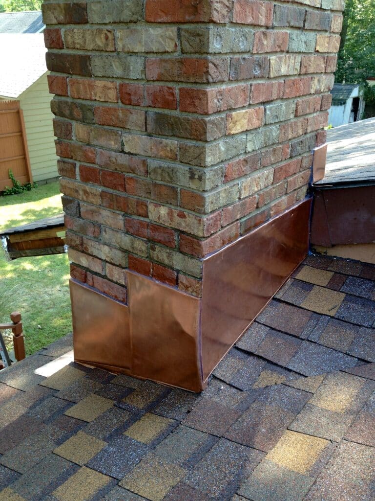 Superior Somerset Nj Roofers Different Forms of Nj Roof Repair Flashing Applications a Brick Chimney with Copper Flashing on the Roof Nj Roofing Company