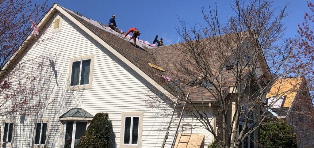 Monroe Nj Roof Repair Services 3 Men Working on a Roof Nj East Brunswick Roof Repair Service