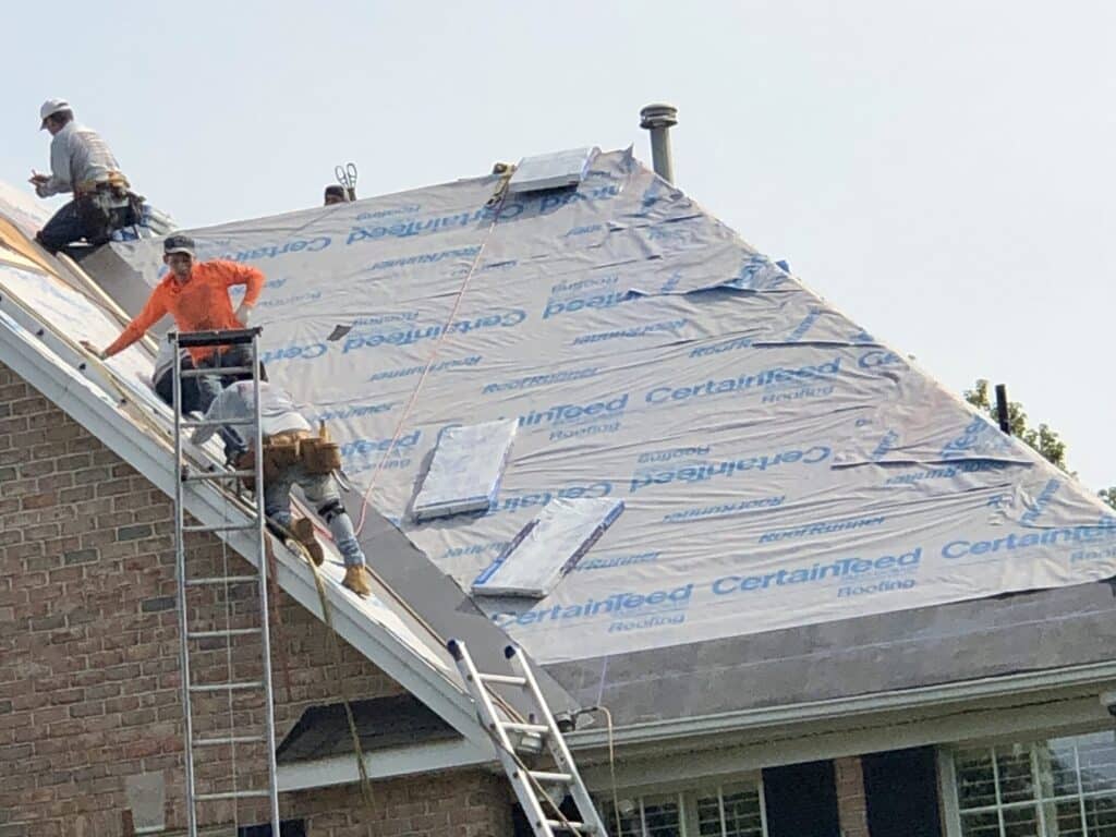 High Performance Synthetic Underlayment new Jersey Residential Roofing a Man Standing on the Roof of a House Installing a High Performance Synthetic Underlayment