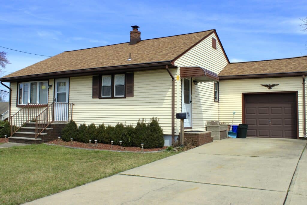 Fabulous Somerset Nj Roofing Installations New Roof a House with a Driveway and Garage in Front of It