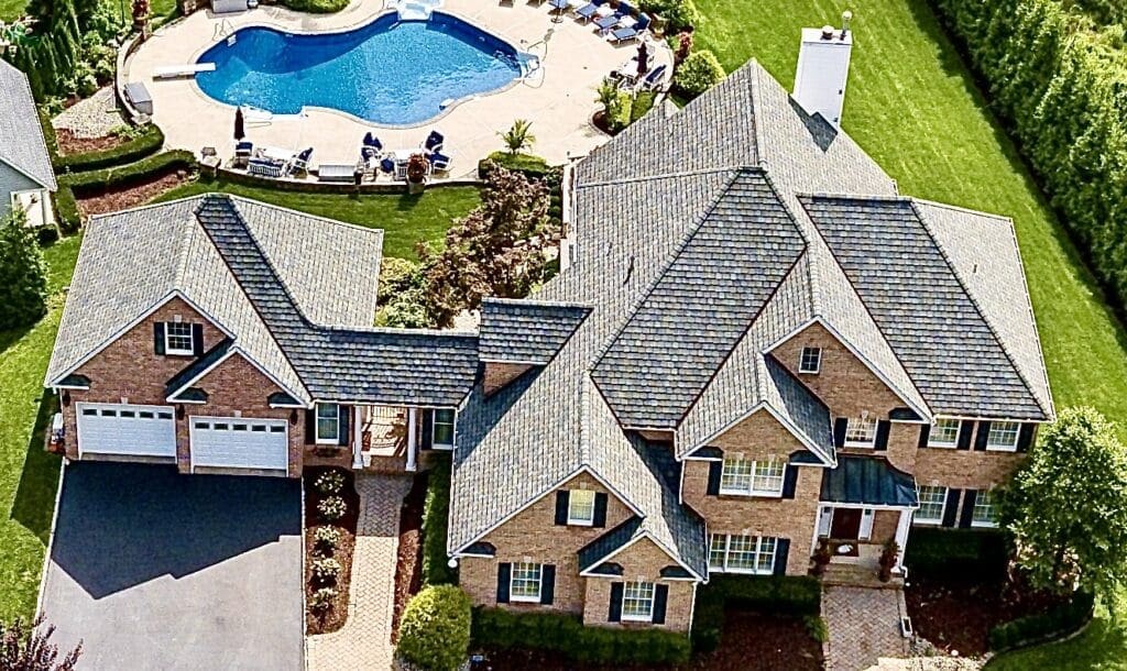 Certainteed East Brunswick Nj Roofing Installations a Purple Letter B in Front of a Green Background