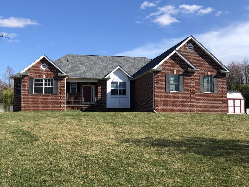 Most Trusted East Brunswick Nj Roofers New Roof Installed on Red Brick House