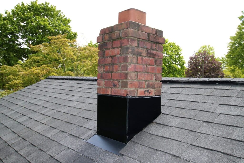 Professional Monmouth Junction Nj Roofers Counter Flashing Installation New Counter Flashing Installed Around Brick Chimney