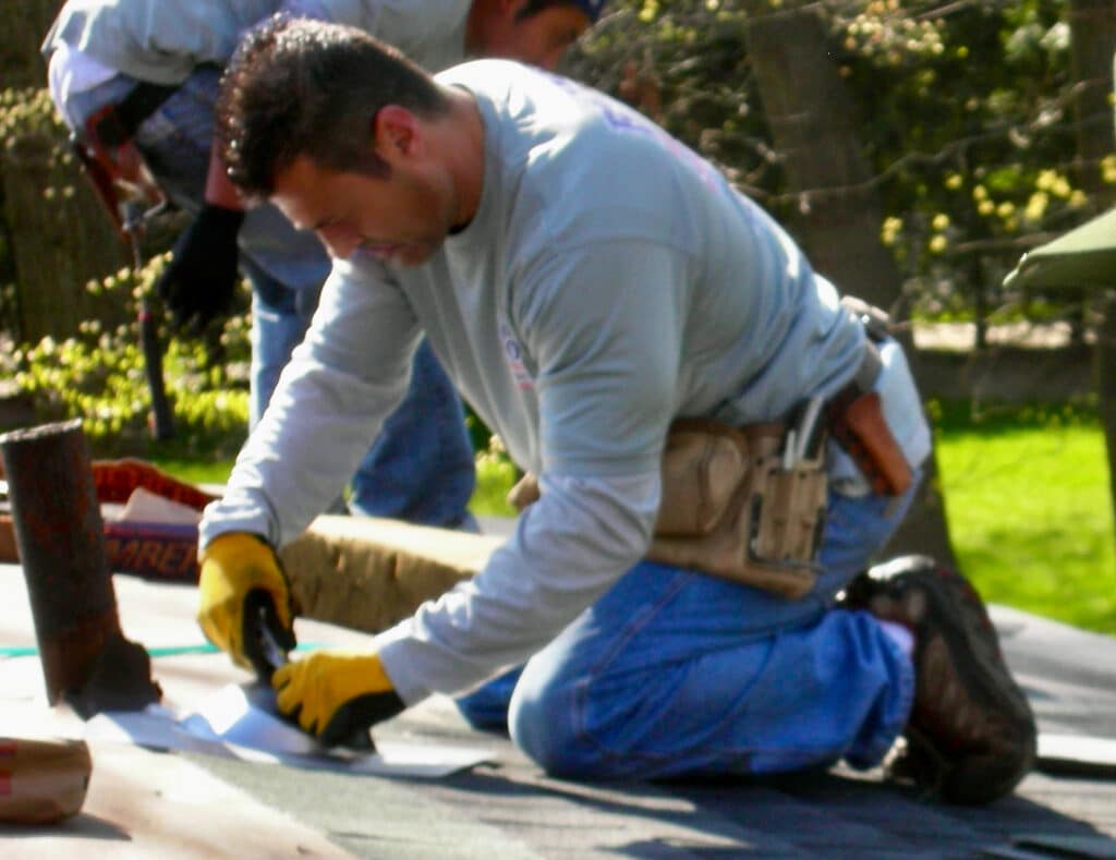 Roofing Contractors Technique technology and Supreme Leadership Man on Roof Installing a New Pipe Flange Around an Existing Vent Pipe